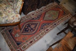 A traditional carpet runner, approx 230 x 75cm