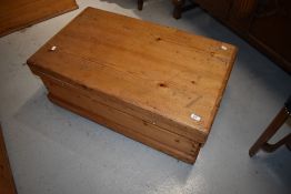 A stripped pine bedding box