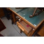 A vintage oak desk of small proportions with single bank of three drawers