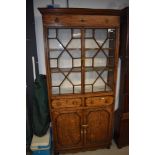 A 19th Century shallow one piece bookcase, astral glazing to top, two drawers to centre , double