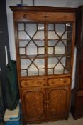 A 19th Century shallow one piece bookcase, astral glazing to top, two drawers to centre , double