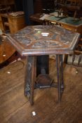 A 19th Century occasional table having hexagonal top with carved and pokerwork decoration