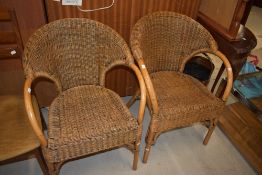 A pair of canework conservatory chairs