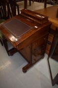 A Victorian walnut davenport desk