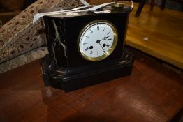 A Victorian marble mantel clock