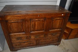 A 19th Century oak and mahogany coffer having flap top over drawer base (af)