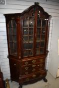 A late 19th or early 20th Century mahogany display cabinet in the William and Mary style having