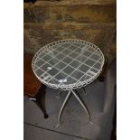 A modern metal and glass conservatory side table