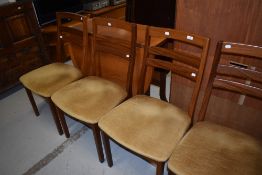 A 1990 Nathan gateleg dining table and set of four rail back dining chairs with dralon upholstery