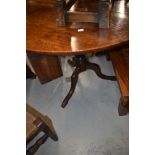 A 19th Century oak pedestal table having circular top, on turned column and triple splay legs,