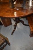 A 19th Century oak pedestal table having circular top, on turned column and triple splay legs,