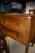 An early to mid 20th Century oak and ply bedroom chest of two drawers