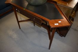 A vintage sapele side or dressing table of stylised form