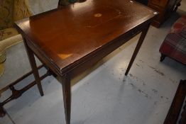 A reproduction Edwardian style fold over card table