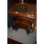 A 19th Century mahogany Davenport style desk having open shelves under