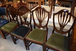 A set of four early 20th Cntury mahogany shield back dining chairs