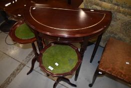 A reproduction demi lune side table and two occasional wine tables