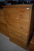 A natural pine chest of four deep drawers
