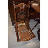 A 19th Century folding campaign style chair having canework seat and inlaid decoration throughout