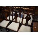 A set of six early 20th Century stained frame vase back dining chairs