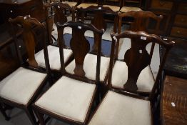 A set of six early 20th Century stained frame vase back dining chairs