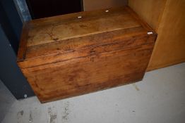 A rustic blanket box and quantity of scatter cushions