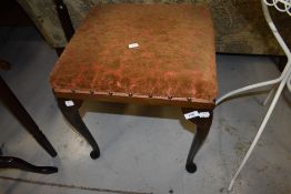An early 20th Century stained frame stool having upholstered seat