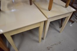 A pair of painted side tables