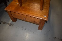 A modern pine square coffee table