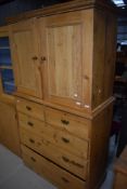 A Victorian stripped pine linen press or larder cupboard