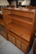 A Nathan side bookshelf with drawer and double cupboard under