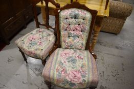 Two matching Victorian chairs having later upholstery