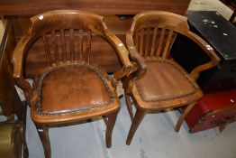 A pair of early 20th Century oak office style armchairs