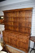 A reproduction oak dresser (Titchmarsh and Goodwin or similar) in the period style