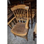 A Victorian stripped spindle back armchair