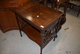 An Edwardian mahogany side table having line inlay decoration, fretwork ends
