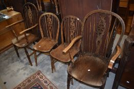 A set of six (four plus two) wheelback kitchen dining chairs