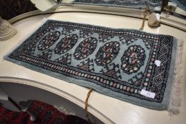 A traditional prayer style rug , approx. 62 x 32cm