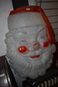 A novelty plastic santa head of large proportions from Blackpool illuminations
