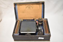 The Standard EP magic lantern by Ernst Plank in original wooden box with lens, burner and slides