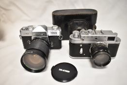 Two cameras. A Fujica ST701 with Sunactinon Auto zoom f28-80mm 1:3,5-4,5 lens, and a Zorki -4 camera