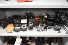 A selection of camera accessories including Olympus OM Motor Drive 2, Mamiya grip, Sunpack grip/