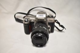 A Nikon F80 camera with Nikon AF Nikkor 28-70mm 1:3,5-4,5D lens