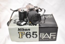 A Nikon F65 camera with Nikon AF Nikkor 28-80mm 1:3,5-4,6D lens