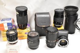 A selection of lenses. A Sigme zoom 24-70mm 1:3,5-5,6, a Soligal zoom macro 35-200mm 1:3,8-5,3, a