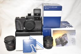 A Hasselblad Xpan II system with camera body, Xpan F4/45mm lens, XPan F5,6 30mm lens, a 30mm