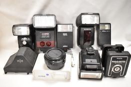 A selection of various flash shoes including Nikon, Olympus, Cobra etc