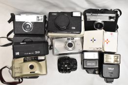 A goldline Supreme camera, a canon z135, Kodak Tele-Ektra 32, Kodak Instamatic, Hanimex IC1000, a