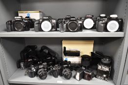 A Collection of Minolta SLR camera bodies, lenses etc. A Minolta Dynax 5000i, two Dynax 3xi, a Dynax