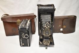 A coronet cine camera and a Kodak 1A folding camera